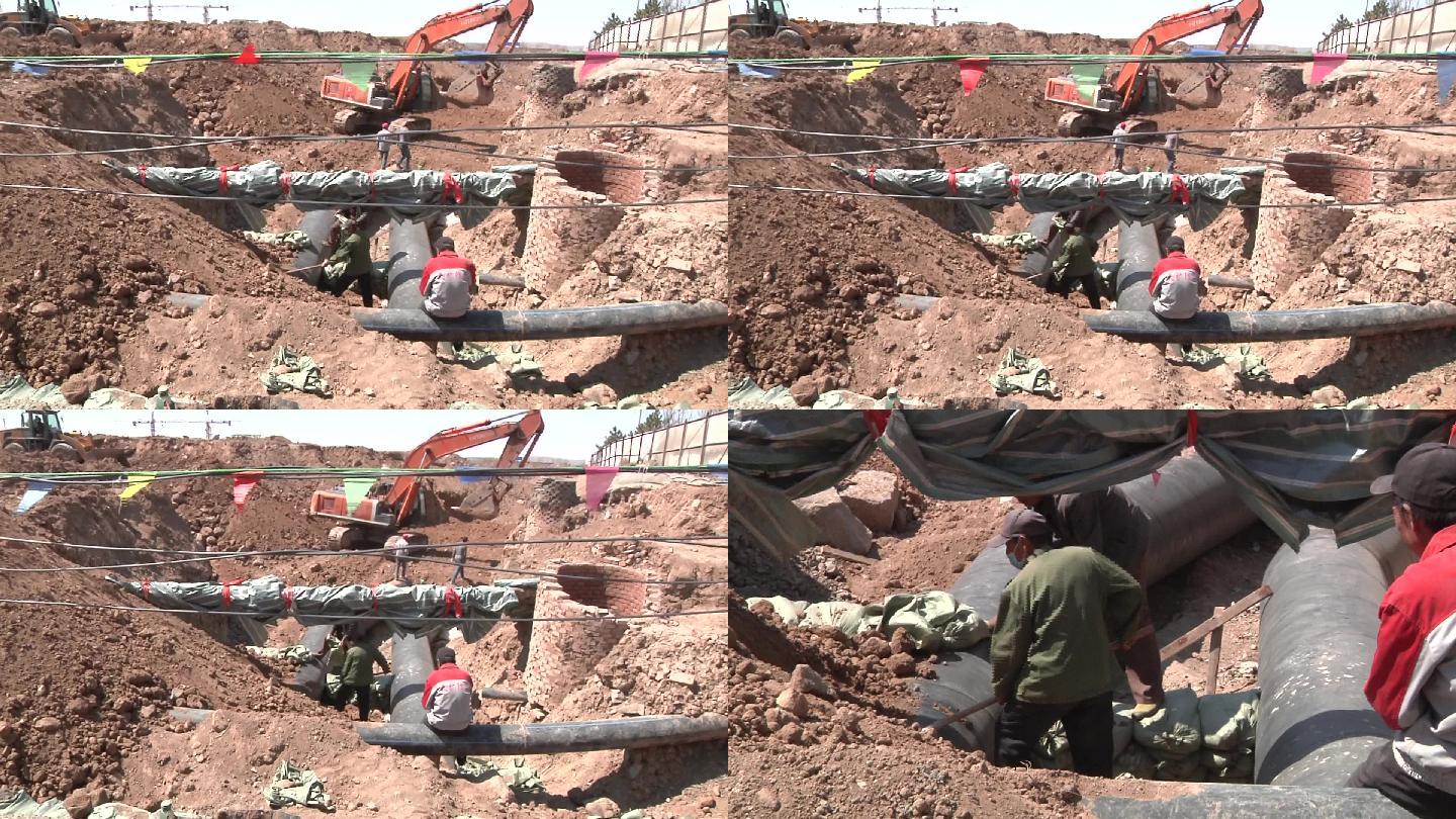 工人修理铺设供水管道